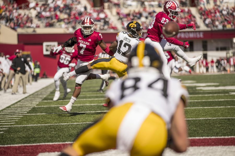 Iowa wide receiver Nick Easley (84) makes a diving catch on a deflected pass for a touchdown during Iowa's game against Indiana at Memorial Stadium in Bloomington on Saturday, October 13, 2018. The Hawkeyes defeated the Hoosiers 42-16.