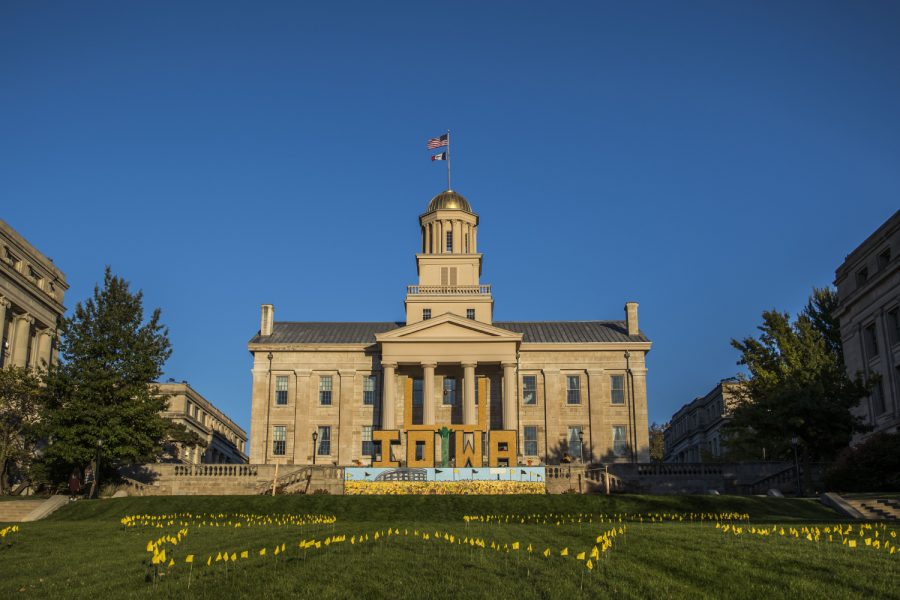 The Old Capitol is seen with the Iowa Homecoming Corn Statue in front on Thursday, October 18, 2018. 