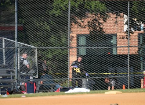 Policemen work at the site of the shooting where Steve Scalise was shot at Eugene Simpson Stadium Park in Alexandria, Virginia, on June 14, 2017. (Yin Bogu/Xinhua/Zuma Press)