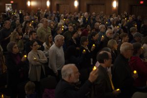 More than 100 people held candles while singing traditional Jewish songs during a vigil for the shootings in Pittsburgh and Louisville in the Iowa Memorial Union on Tuesday, Oct. 30, 2018. Members of the Jewish and African American communities came to mourn the loss of those who were killed in last weeks shootings at Kroger and Tree of Life Synagogue.