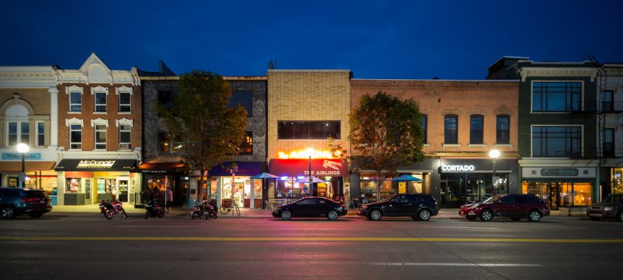 In this composite photo, businesses line Clinton St. in Iowa City on a summer evening. Tuesday, September 12, 2017. 