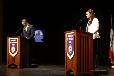 Both candidates stand ready during the Rob Blum and Abby Finkenaur debate at the University of Northern Iowa on Oct. 5, 2018. Blum and Finkenaur discussed many current issues including gun control and Brett Kavanaugh.