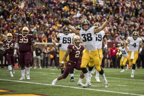 Iowa tight end T.J. Hockenson celebrates after catching a touchdown pass during Iowas game against Minnesota at TCF Bank Stadium on Saturday, Oct. 6, 2018.