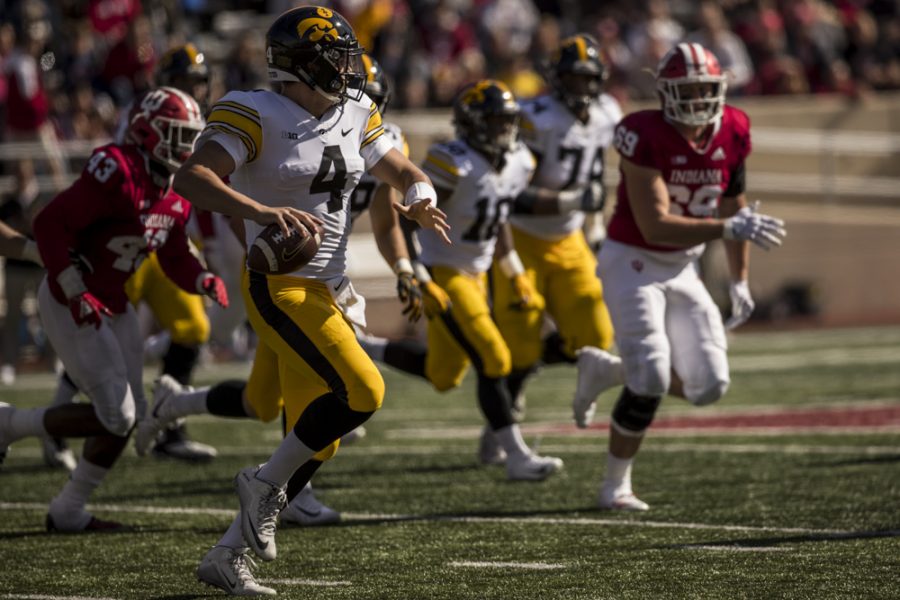 Iowa quarterback Nate Stanley throws on the run during Iowas game against Indiana at Memorial Stadium in Bloomington on Saturday, October 13, 2018. The Hawkeyes defeated the Hoosiers 42-16.