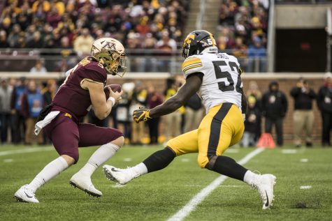 Minnesota quarterback Zack Annexstad is pressured by Iowa linebacker Amani Jones during Iowas game against Minnesota at TCF Bank Stadium on Saturday, October 6, 2018. The Hawkeyes defeated the Golden Gophers 48-31.