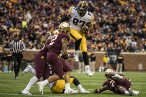 Iowa tight end Noah Fant hurdles a defender during Iowas game against Minnesota at TCF Bank Stadium on Saturday, Oct. 6, 2018. The Hawkeyes defeated the Golden Gophers 48-31.