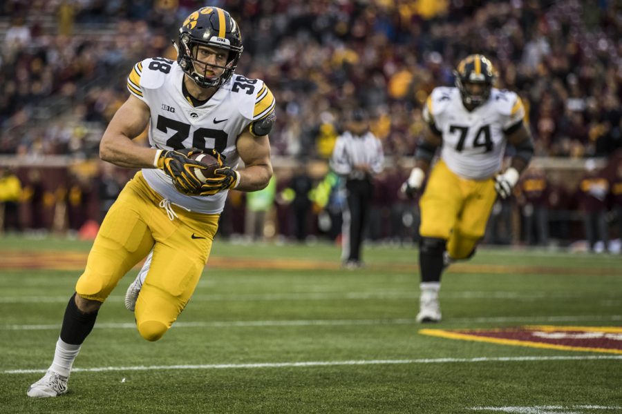 Iowa+tight+end+T.J.+Hockenson+runs+after+making+a+catch+during+Iowas+game+against+Minnesota+at+TCF+Bank+Stadium+on+Saturday%2C+October+6%2C+2018.+The+Hawkeyes+defeated+the+Golden+Gophers+48-31.