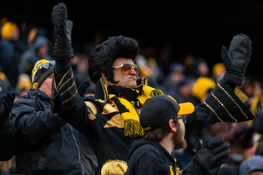 A fan dressed as Elvis cheers from the stands during a game against Northwestern University on Saturday, Nov. 10, 2018 at Kinnick Stadium in Iowa City. The Wildcats defeated the Hawkeyes 14-10. 