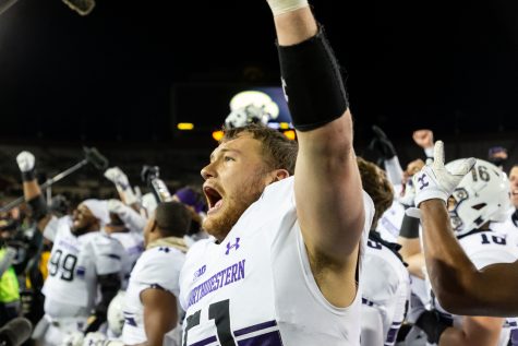 Northwestern linebacker Blake Gallagher #51 celebrates after a game against Northwestern University on Saturday, Nov. 10, 2018 at Kinnick Stadium in Iowa City. The Wildcats defeated the Hawkeyes 14-10. (David Harmantas/The Daily Iowan)