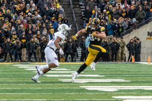 Iowa wide receiver Nick Easley (84) runs away from a defender during a game against Northwestern University on Saturday, Nov. 10, 2018 at Kinnick Stadium in Iowa City. The Wildcats defeated the Hawkeyes 14-10. 