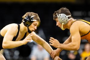 Iowas #1 ranked Spencer Lee grapples with Princetons #14 ranked Patrick Glory in a 125-lb weight class bout at Carver-Hawkeye Arena on Friday, Nov. 16, 2018. Lee won via Technical Fall, 17-2. (David Harmantas/The Daily Iowan)