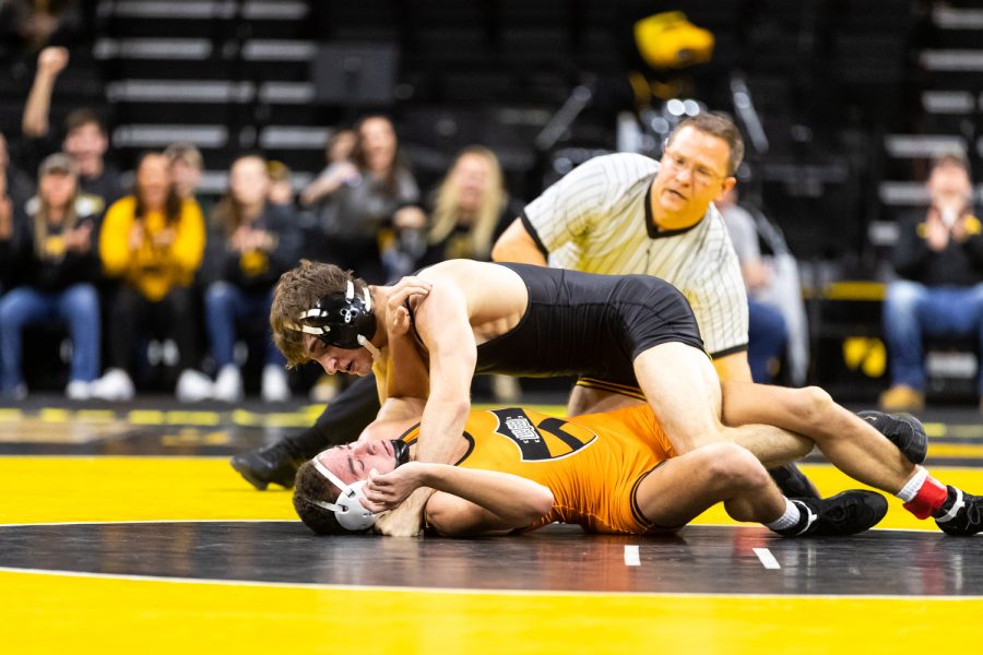Iowas+%2311+ranked+Austin+DeSanto+grapples+with+Princetons+Jonathan+Gomez+in+a+125-lb+weight+class+bout+at+Carver-Hawkeye+Arena+on+Friday%2C+Nov.+16%2C+2018.+DeSanto+pinned+Gomez+in+3%3A27.+%28David+Harmantas%2FThe+Daily+Iowan%29
