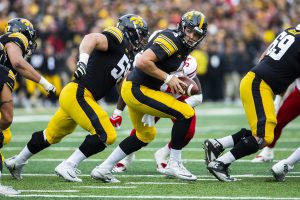 Iowa quarterback Nate Stanley looks to pass the ball during the Iowa/Nebraska football game at Kinnick Stadium on Friday, November 23, 2018. The Hawkeyes defeated the Huskers, 31-28, with a last second field goal. 