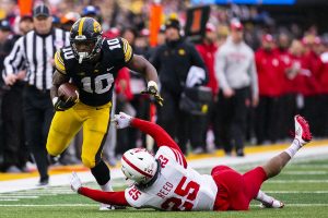 Iowa running back Mekhi Sargent sheds Nebraska safety Antonio Reeds tackle during the Iowa/Nebraska football game at Kinnick Stadium on Friday, Nov. 23, 2018. The Hawkeyes defeated the Huskers, 31-28, with a last-second field goal. 