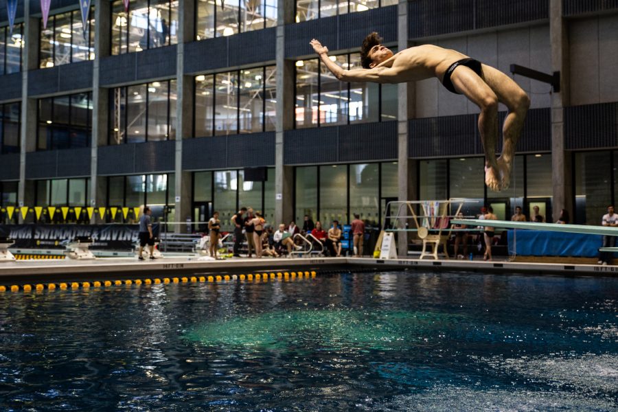 A Missouri State diver flips off the diving board during the Hawkeye Invitational Swimming and Diving Meet on Friday, November 16, 2018. Fifteen university swimming and diving teams competed at this event. 