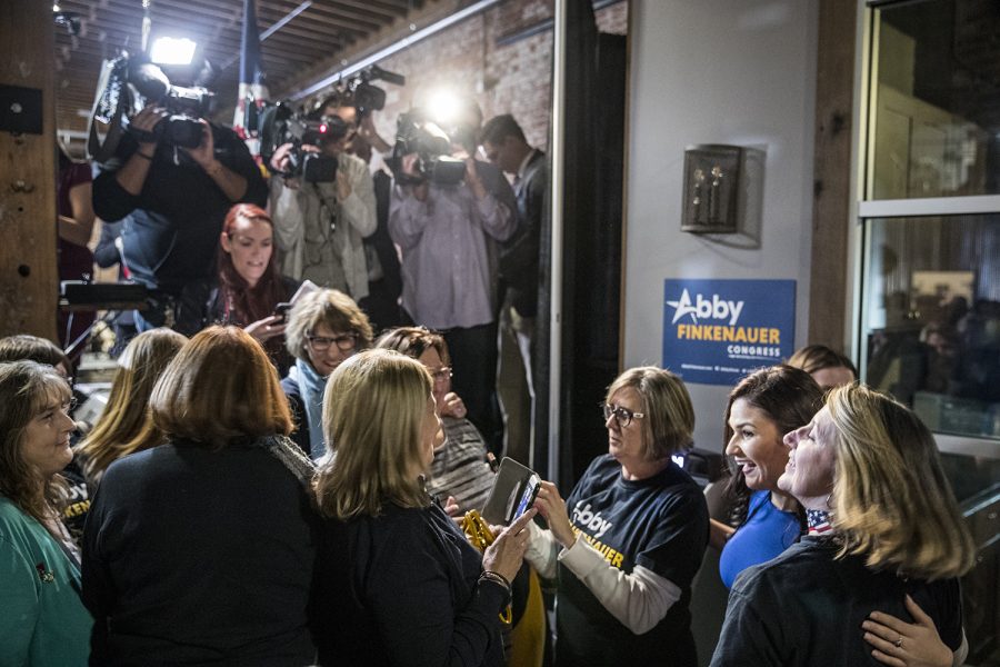 Democratic candidate for Iowa’s first congressional district Abby Finkenauer takes pictures with supporters during a watch party at 7 Hills Brewing Company in Dubuque Iowa on Tuesday Nov. 6, 2018. Finkenauer defeated incumbent Republican Rod Blum and, along with Alexandria Ocasio-Cortez, NY-14, becomes one of the first women under 30 elected to the U.S. House of Representatives. 
