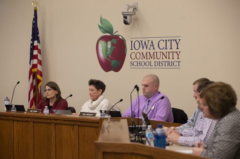 School Board members listen as people raise concerns about school rezoning at the School District Administration Building on Tuesday. At the meeting, board members voted to redraw school zones in an effort to create a more equitable learning system. 