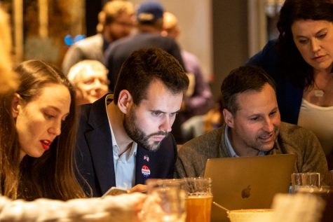Iowa Senate Democratic Candidate Zach Wahls watches election results on his laptop during an election night watch party at Big Grove Brewery in Iowa City on Tuesday, Nov. 6, 2018. 