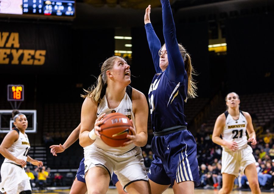 Iowa forward/center Monika Czinano #25 pulls the ball down during a womens basketball game against Oral Roberts University on Friday, Nov. 9, 2018. The Hawkeyes defeated the Golden Eagles 90-77. 