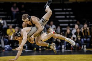 Iowas Carter Happel takes down Purdues Parker Filius during Iowas dual meet against Purdue at Carver-Hawkeye Arena in Iowa City on Saturday, Nov. 24, 2018. Happel defeated Filus 2-0 and The Hawkeyes defeated the Boilermakers 26-9.