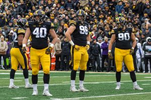 Iowa defensive end Parker Hesse (40), Iowa defensive end Matt Nelson (96), and Iowa defensive end Sam Brincks (90) look back towards their bench during a game against Northwestern on Saturday, Nov. 10 at Kinnick Stadium. The Wildcats defeated the Hawkeyes 14-10. 