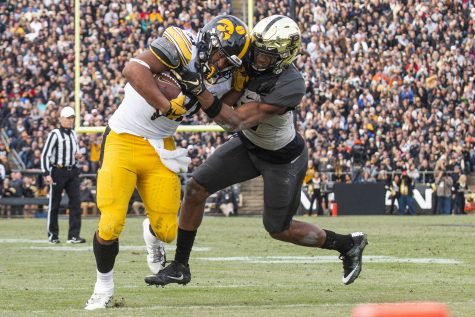 Iowa running back Ivory Kelly-Martin runs the ball during the Iowa/Purdue game at Ross-Ade Stadium in West Lafayette, Indiana on Saturday, Nov. 3, 2018. The Boilermakers defeated the Hawkeyes 38-36. 