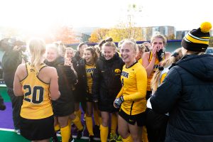 Iowa midfielder Makenna Grewe (center, left) smiles as the Iowa field hockey team celebrates after the Semifinals in the Big Ten Field Hockey Tournament at Lakeside Field in Evanston, Illinois, on Friday, Nov. 2, 2018. The No. 8 ranked Hawkeyes defeated the No. 7 ranked Wolverines 2-1. 