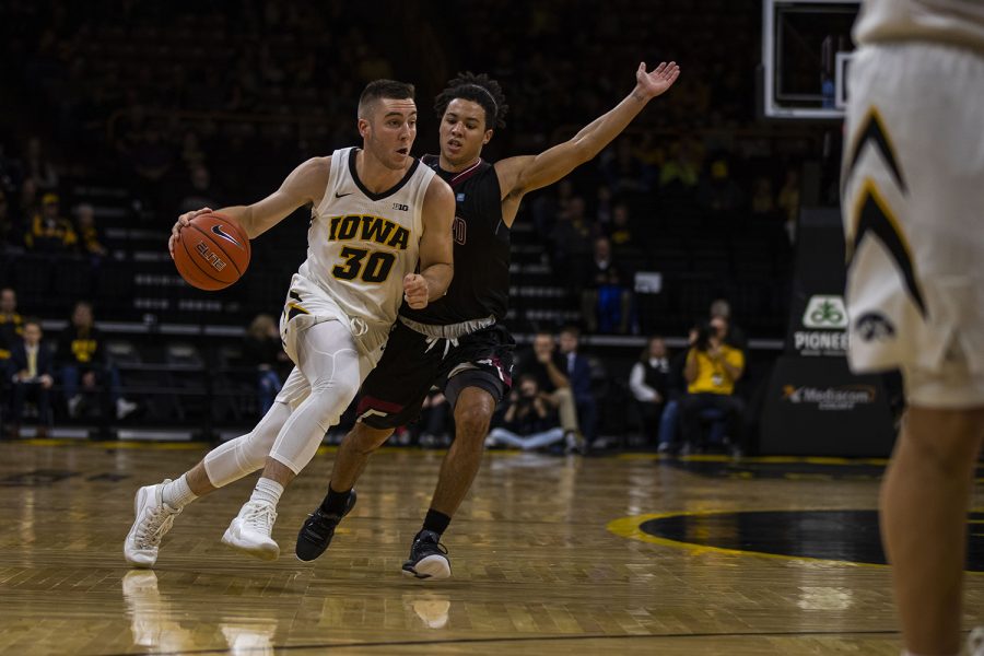 Iowa guard Connor McCaffery drives to the hoop during the Iowa/Guilford College basketball game at Carver-Hawkeye Arena on Sunday, Nov. 4, 2018. The Hawkeyes defeated the Quakers, 103-46. (Lily Smith/The Daily Iowan)