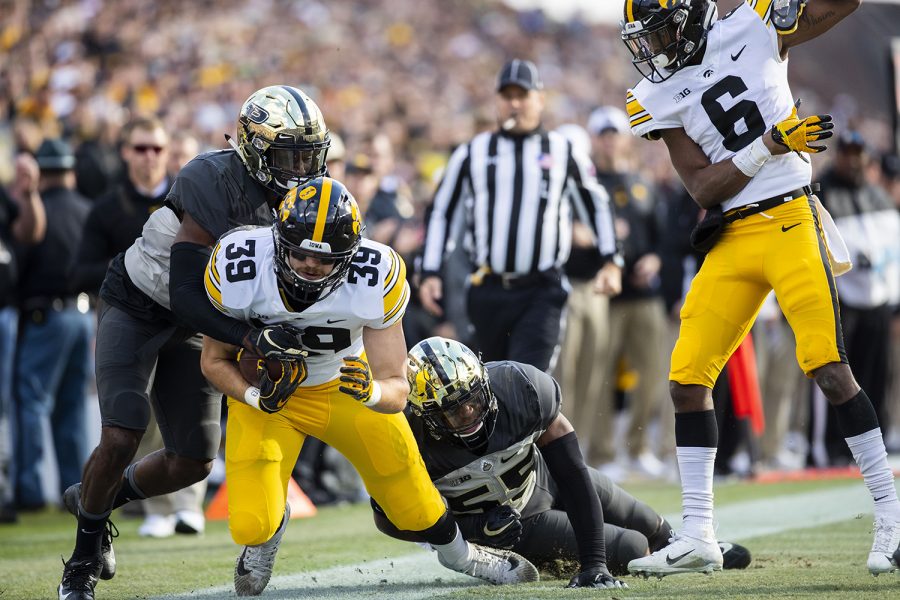 Iowa tight end Nate Wieting gets tackled  by Purdue defense during the Iowa/Purdue game at Ross-Ade Stadium in West Lafayette, Ind. The Boilermakers defeated the Hawkeyes, 38-36, with a last second field goal. 
