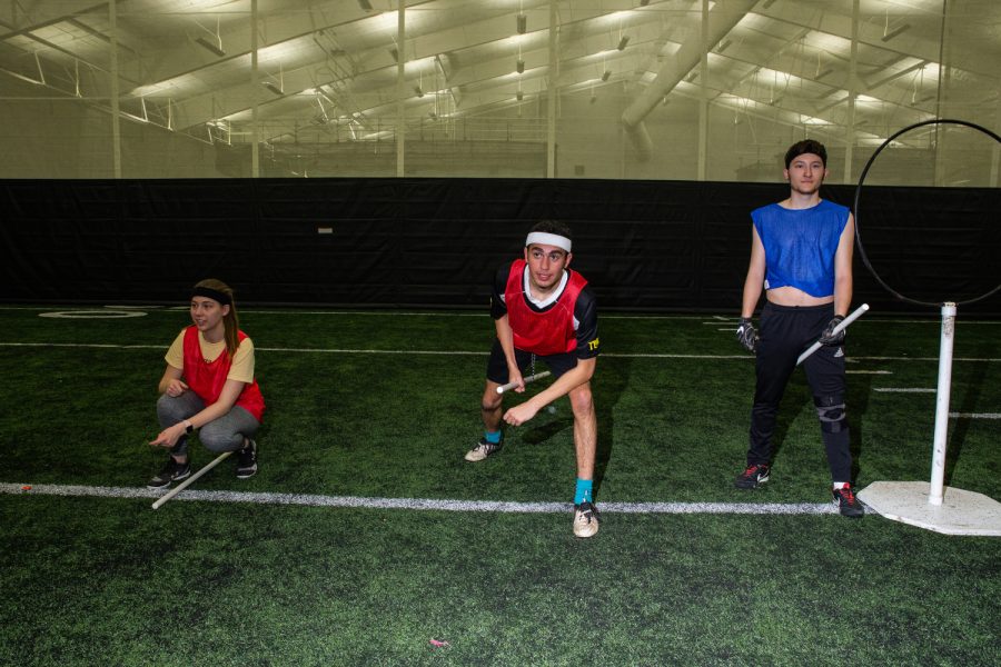 The University of Iowa Club Quidditch team prepares for an inter-squad scrimmage at the Hawkeye Tennis and Recreation Complex on Wednesday, Nov. 14, 2018.