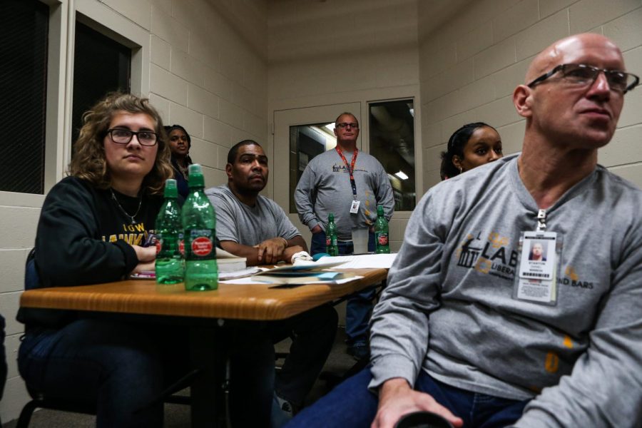 Students participate in a discussion during a "One Community, One Book" class at Oakdale Prison on Thursday, Oct. 25, 2018. 