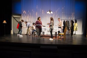 Actors interact and set a table during Why is This Night Different? at the Theater Building on Tuesday, Nov. 27, 2018. The play centers on family drama on Passover. 