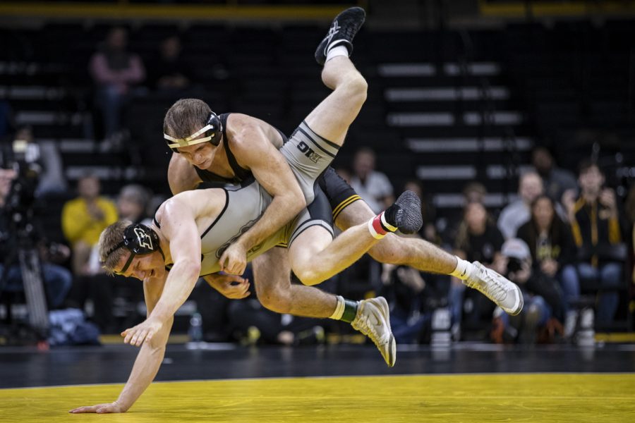 Iowa’s Carter Happell wrestles with Purdue’s Parker Filius during Iowa’s dual meet against Purdue at Carver-Hawkeye Arena in Iowa City on Saturday, Nov. 24, 2018. Happel defeated Filius 2-0 and the Hawkeyes defeated the Boilermakers 26-9.