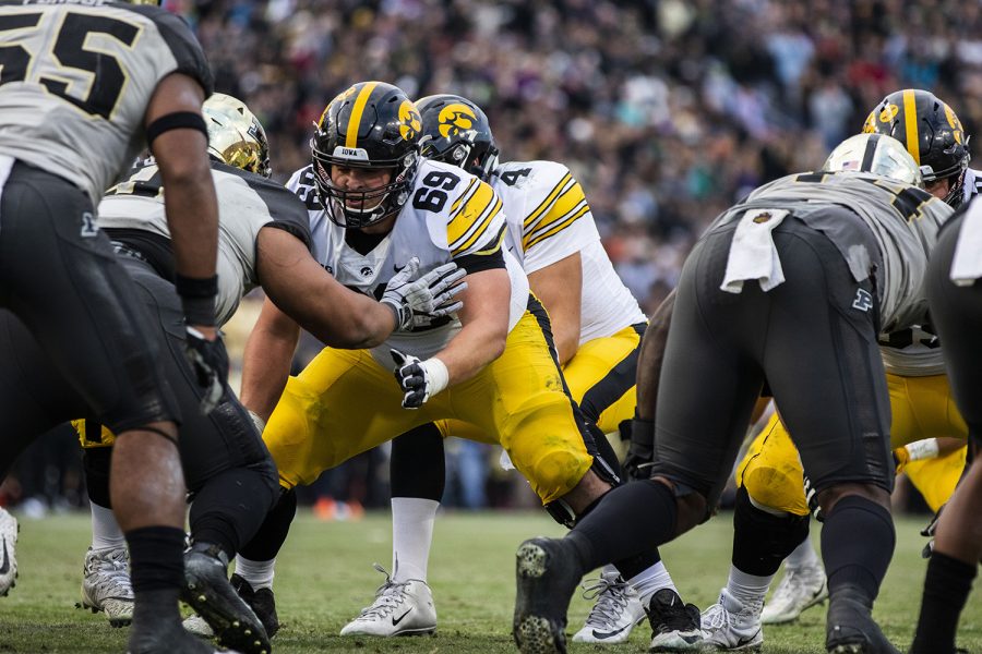 Iowa offensive lineman Keegan Render stands at the line of scrimmage during the Iowa/Purdue game at Ross-Ade Stadium in West Lafayette, Ind. The Boilermakers defeated the Hawkeyes, 38-36, with a last second field goal. (Lily Smith/The Daily Iowan)