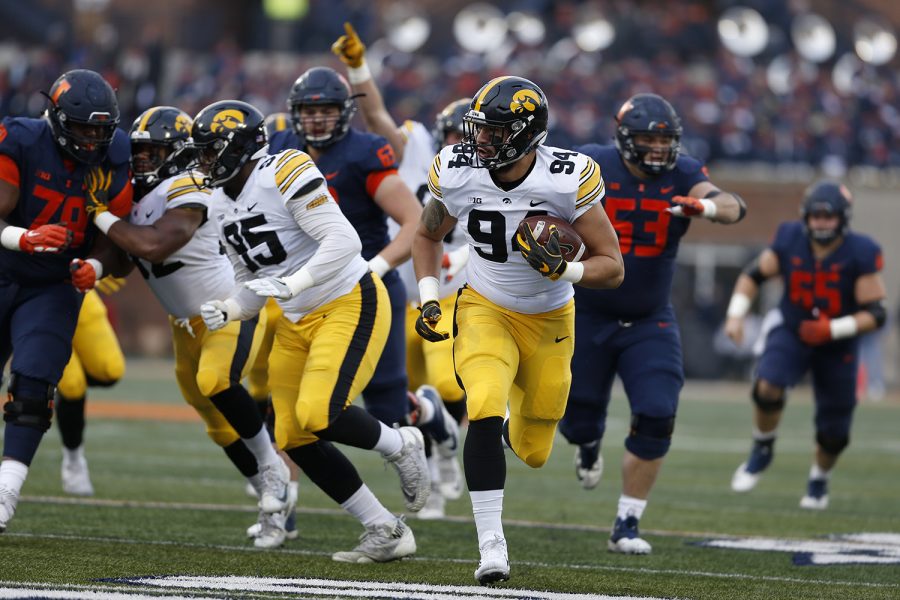 Iowa defensive lineman AJ Epenessa returns a fumble recovery for a touchdown during Iowas game against Illinois at Memorial Stadium in Champaign, IL, on Saturday, Nov. 17, 2018. The Hawkeyes defeated the Fighting Illini 63-0.