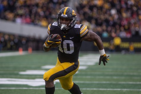 Iowa running back Mehki Sargent carries the ball during the Iowa vs. Nebraska game on Friday, November 23, 2018. Iowa defeated the Huskers 31-28.