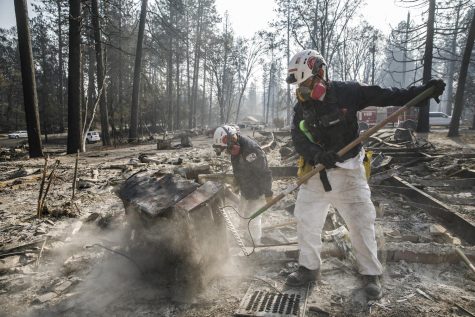 A search and rescue team comb through debris for human remains after the Camp Fire destroyed most of Paradise, California, on Nov. 20, 2018. (Marcus Yam/Los Angeles Times/TNS)