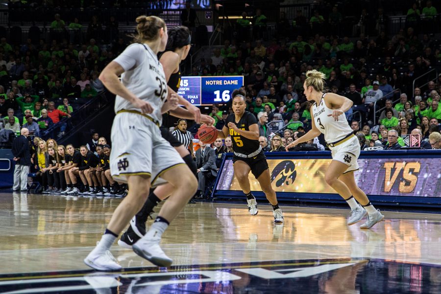 Iowa sophomore Alexis Sevillian dribbles down the court during a basketball match between Iowa and Notre Dame in South Bend, IN on Thursday, November 29, 2018. The Hawkeyes were defeated by the Fighting Irish, 105-71. (Shivansh Ahuja/The Daily Iowan)