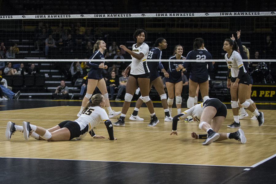 Iowa players dive for the ball during a volleyball match between Iowa and Penn State at Carver-Hawkeye Arena on Saturday, Nov. 3, 2018. The Hawkeyes were shut out by the Nittany Lions, 3-0.