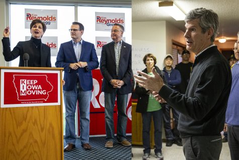 LEFT: Gov. Kim Reynolds speaks during a rally at the Eastern Iowa Airport in Cedar Rapids on Nov. 5 as Lt. Gov. Adam Gregg and Rep. Rod Blum, R-Iowa look on.  RIGHT: Democratic candidate for governor Fred Hubbell speaks to supporters at the home of Janice Weiner on Nov. 5.
