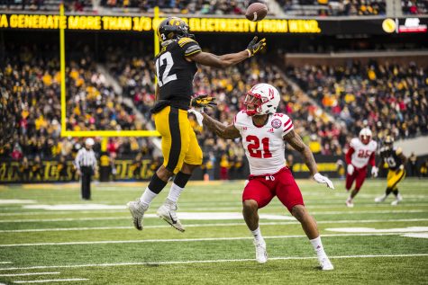 Iowa wide receiver Brandon Smith makes a leaping catch during Iowas game against Nebraska at Kinnick Stadium in Iowa City on Friday, November 23, 2018. The Hawkeyes defeated the Huskers 31-28.