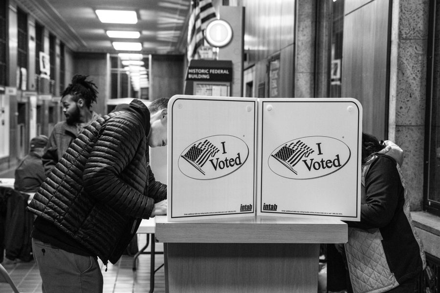 Voters fill out their ballots at a polling location in the Dubuque Historic Federal Building in Dubuque on Tuesday Nov. 6, 2018.