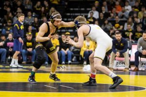 Iowa wrestler Spencer Lee grapples with Michigan wrestler Drew Martin at Carver-Hawkeye Arena on Saturday, Jan. 27, 2018. The Wolverines defeated the Hawkeyes 19-17. 