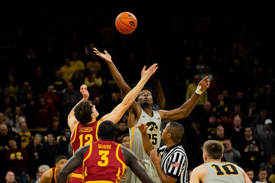 Iowa forward Tyler Cook jumps for the opening tip off during Iowa's game against Iowa State at Carver-Hawkeye Arena on December 6, 2018. The Hawkeyes defeated the Cyclones 98-84.(Megan Nagorzanski/The Daily Iowan)