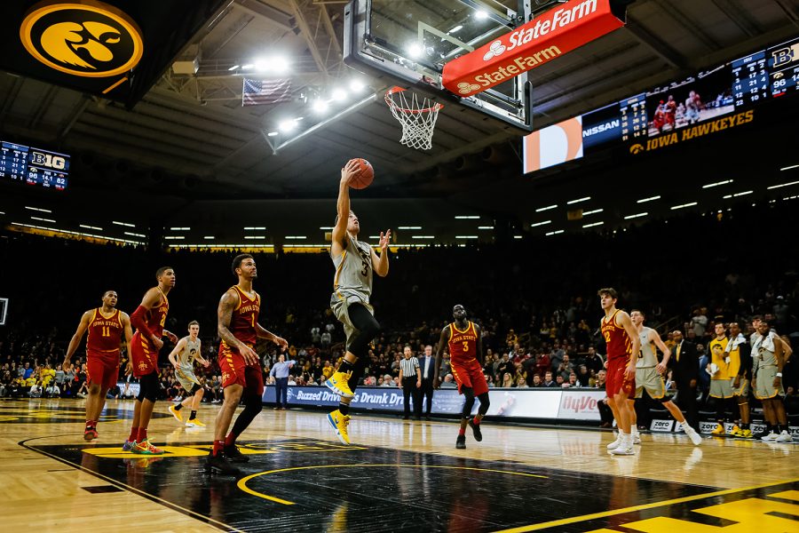 Iowa guard Jordan Bohannon lay-ups during Iowa's game against Iowa State at Carver-Hawkeye Arena on December 6, 2018. The Hawkeyes defeated the Cyclones 98-84.(Megan Nagorzanski/The Daily Iowan)