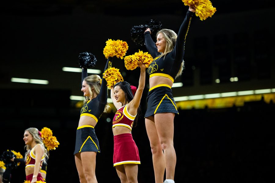 Iowa and Iowa State cheerleaders perform during Iowa's game against Iowa State at Carver-Hawkeye Arena on December 6, 2018. The Hawkeyes defeated the Cyclones 98-84.(Megan Nagorzanski/The Daily Iowan)