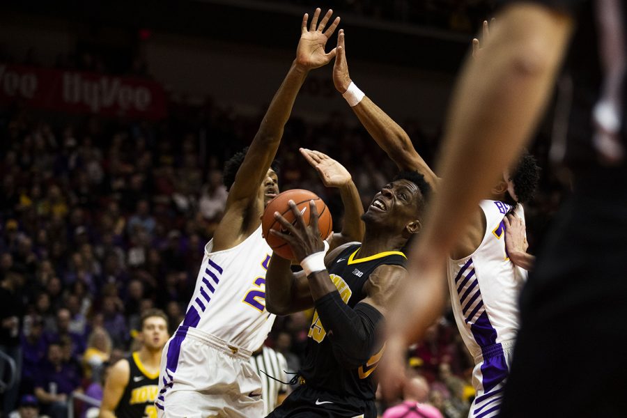 Iowa forward Tyler Cook fights for control of the ball during the Iowa/UNI mens basketball game at Wells Fargo Arena in Des Moines on Saturday, Dec. 15, 2018. The Hawkeyes defeated the Panthers, 77-54. 