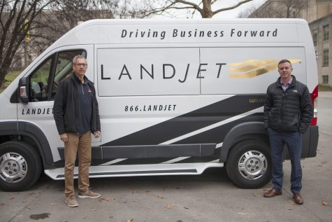 Land Jet CEOs Mark A. Ross and Nick Thul are seen in front of their company van on Monday, December 3, 2018. Land Jet is a rental company that offers a private, mobile office inside their van. (Tate Hildyard/The Daily Iowan).