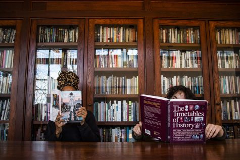 Two students read books in the Dey House on Tuesday, November 27, 2018. Iowa City is celebrating 10 years of being named UNESCO City of Literature. 