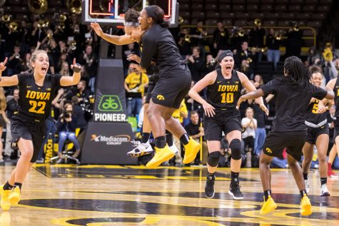 Iowa forward Megan Gustafson #10 and her teammates celebrate after defeating Iowa State in a womens basketball game at Carver-Hawkeye Arena on Wednesday, Dec. 5, 2018. The Hawkeyes defeated the Cyclones 73-70. 